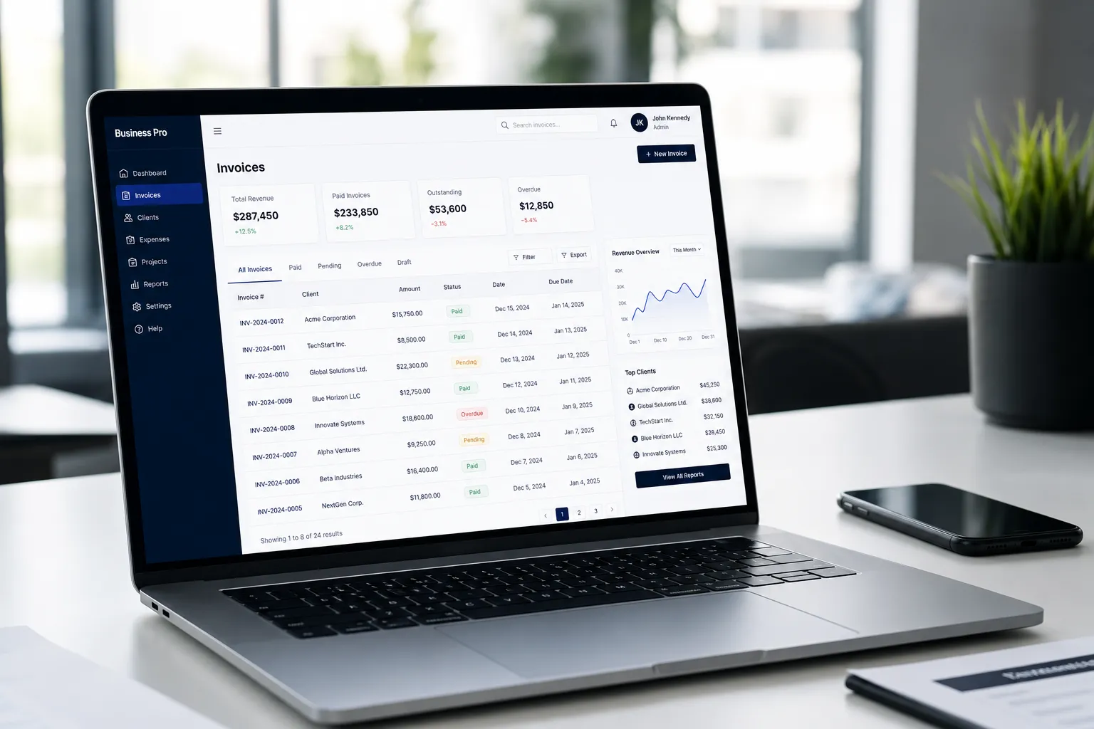 Modern laptop displaying invoice management dashboard in office setting