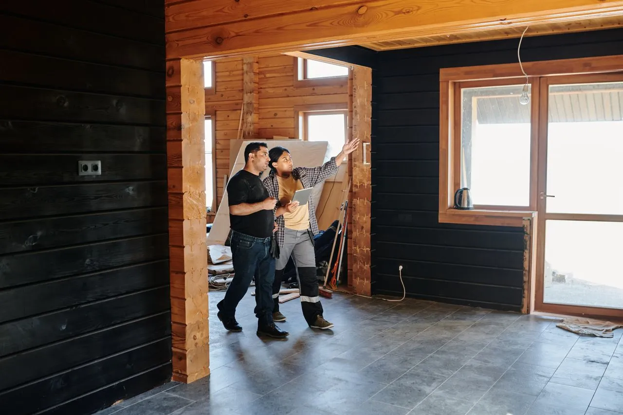 A contractor documenting damage during an inspection